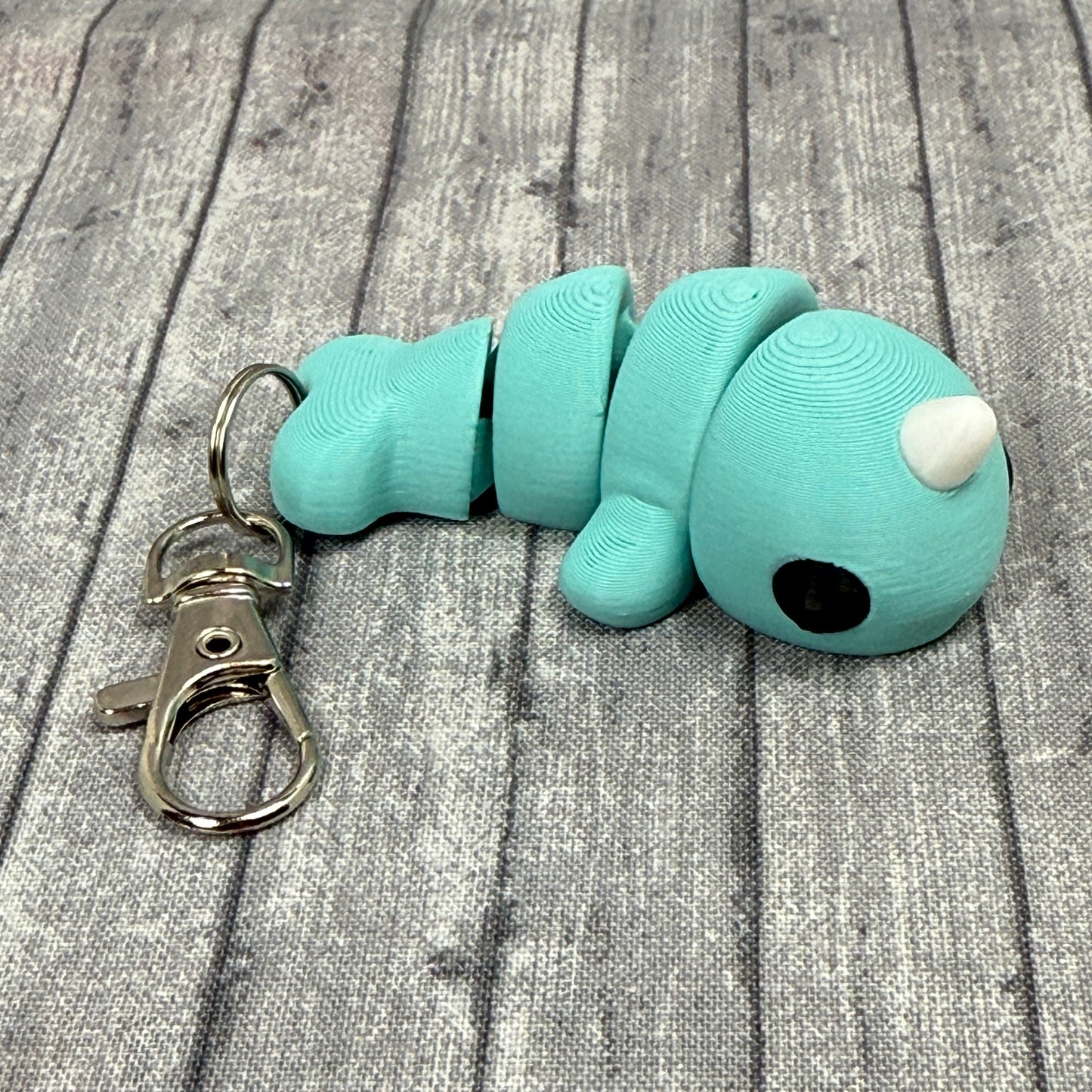 Norman Narwal Fidget Toy Teal Keychain