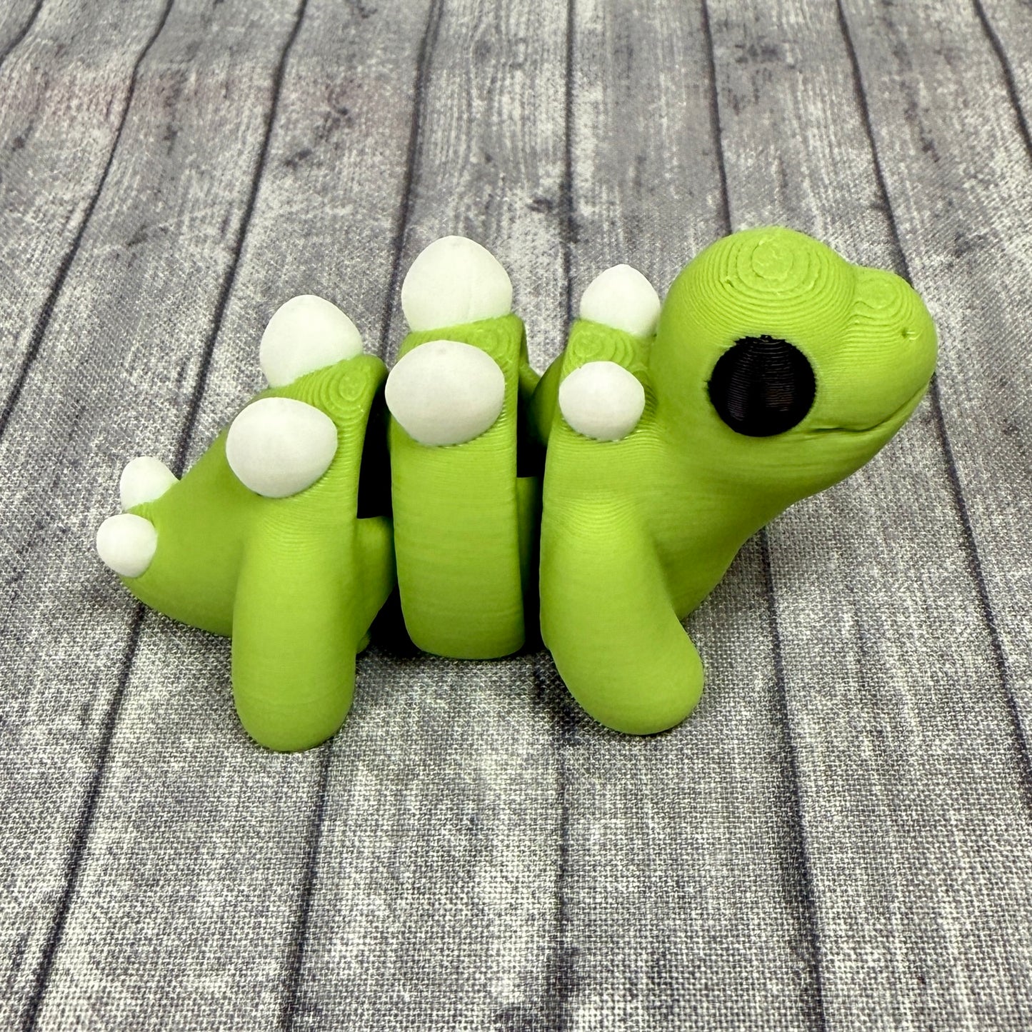 Scout_Stegosaurus_Green_White_Fidget_Toy