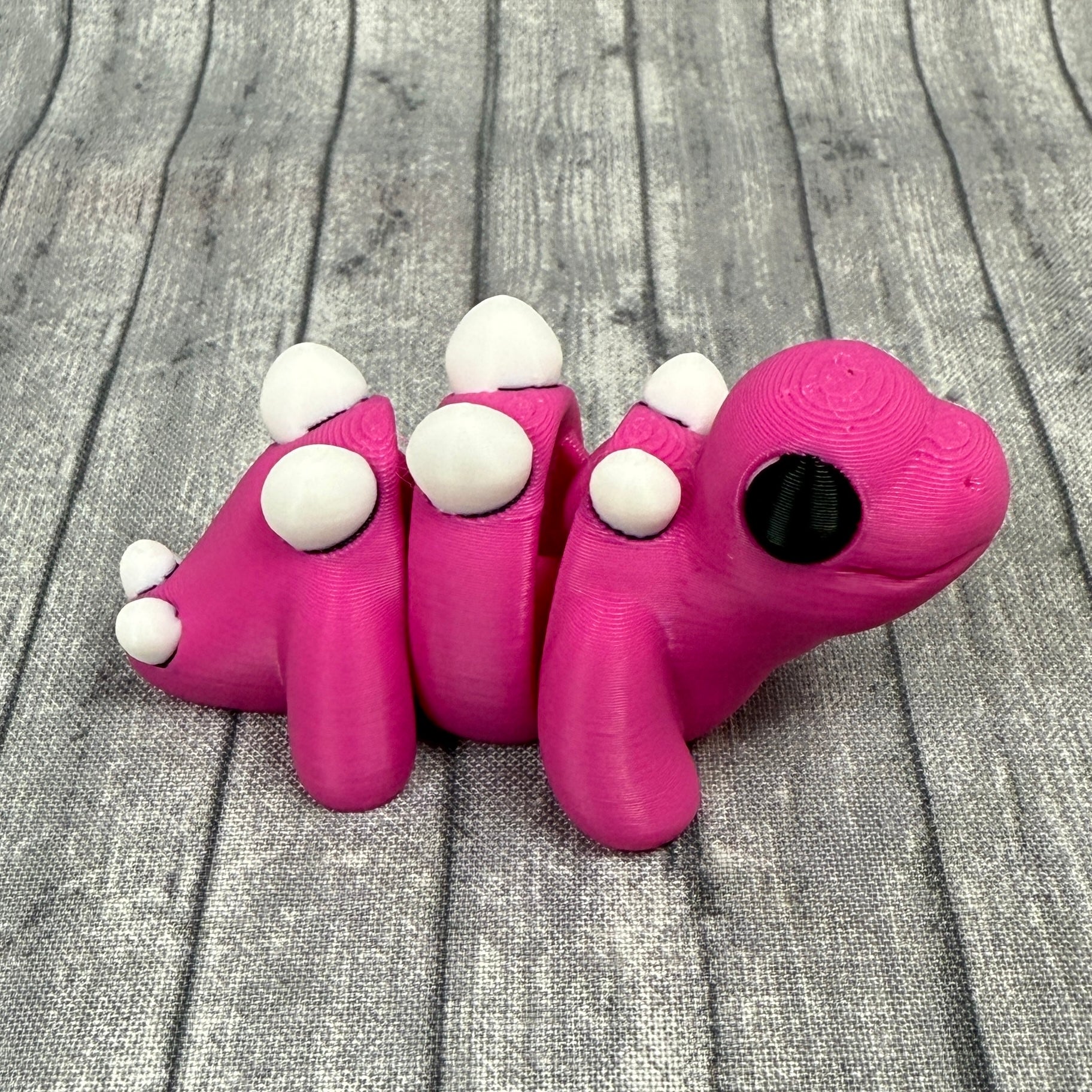 Sunny_Stegosaurus_Pink_White_Fidget_Toy