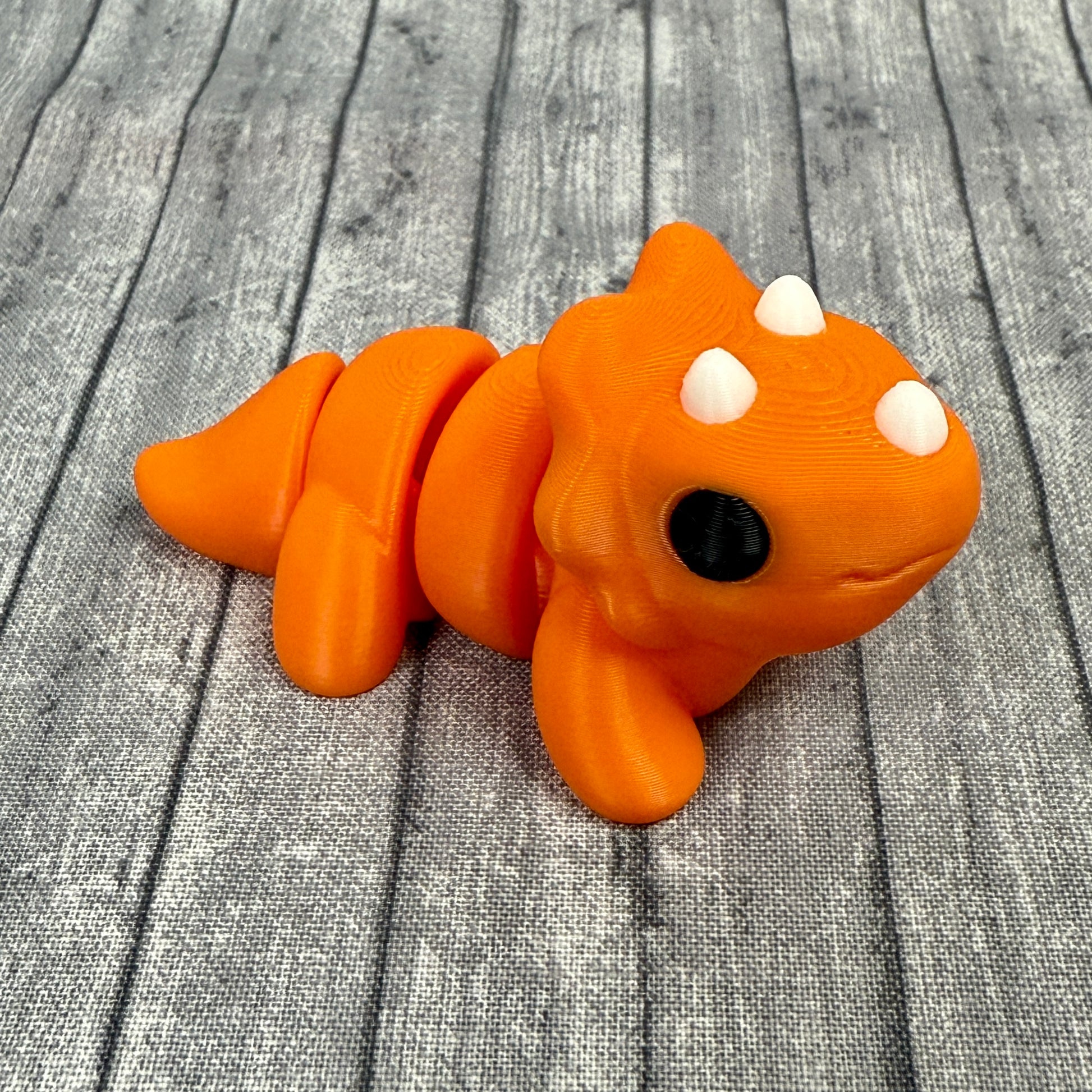 Theo Triceratops Orange White