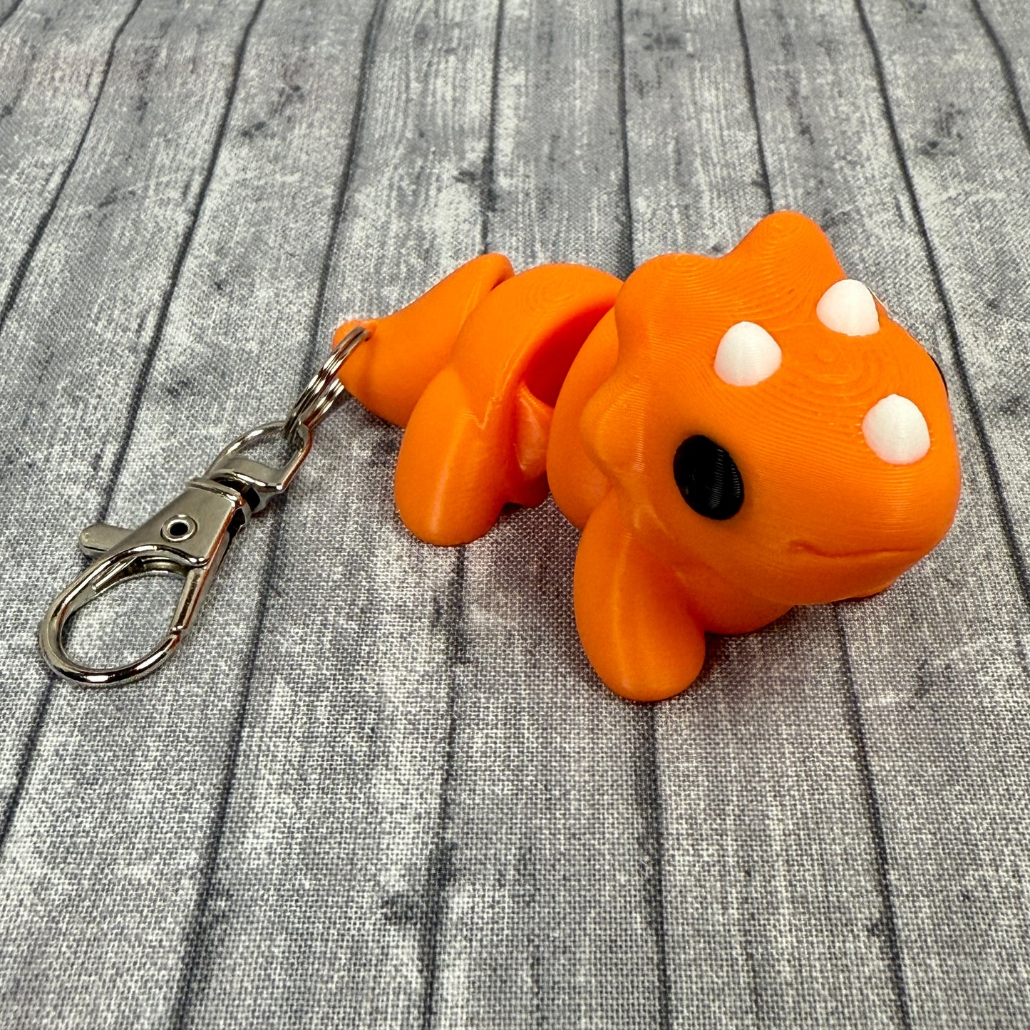 Theo Triceratops Orange White  Keychains