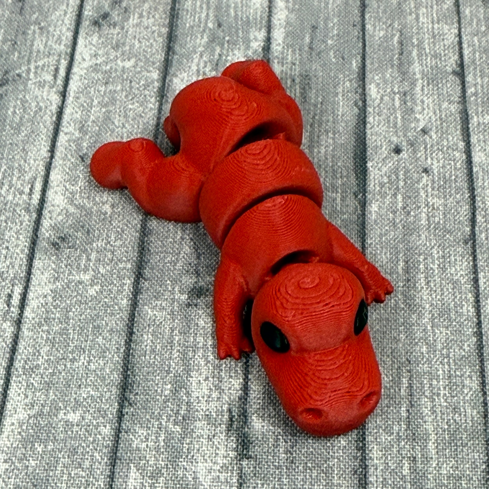 Titan T-Rex fidget toy red