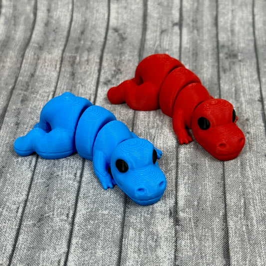 Tyra and Titan T-Rex fidget toy red blue